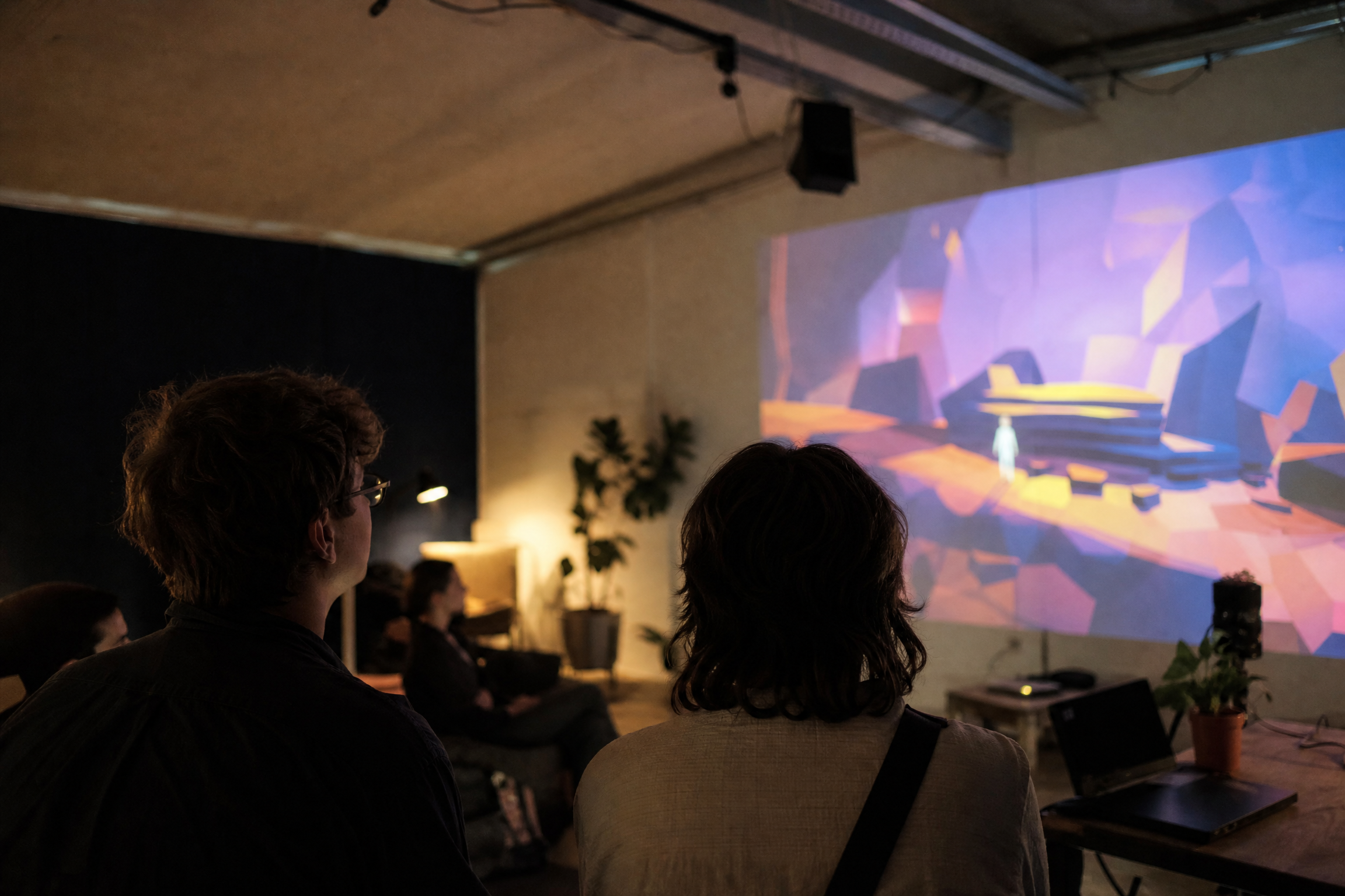 Attendees watching an independent game presentation in Auckland